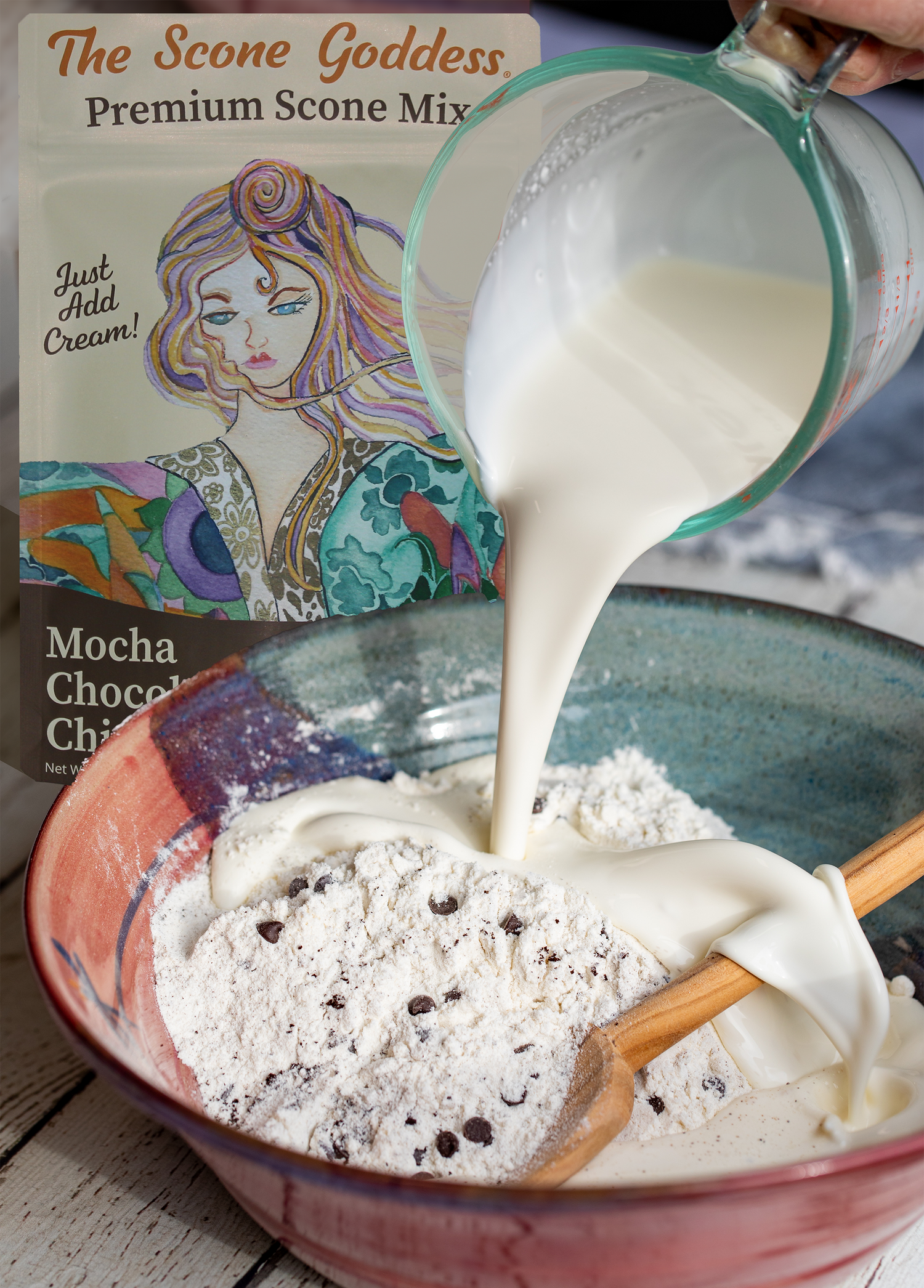 Silky heavy cream being poured over Scone Mix. The Scone Goddess