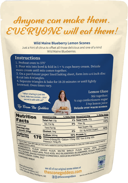 A stand-up pouch of The Scone Goddess Premium Scone Mix, Wild Maine Blueberry Lemon flavor. The packaging features a cream-colored top section with orange and blue text, and a colorful illustration of a woman with flowing hair.