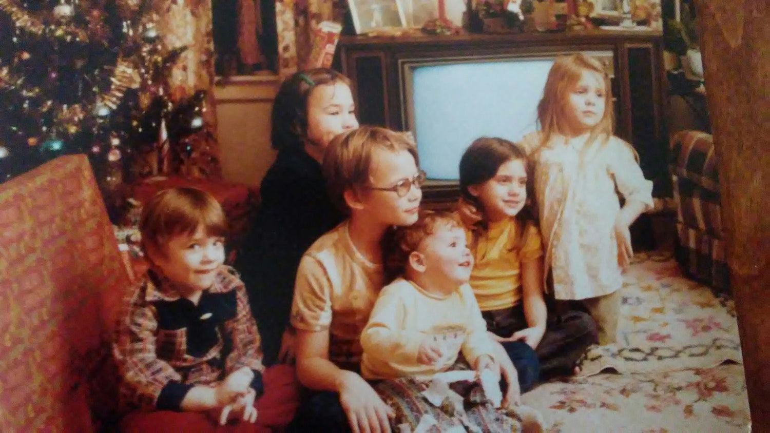 The Scone Goddess as a kid in 1978 sitting around a Christmas tree